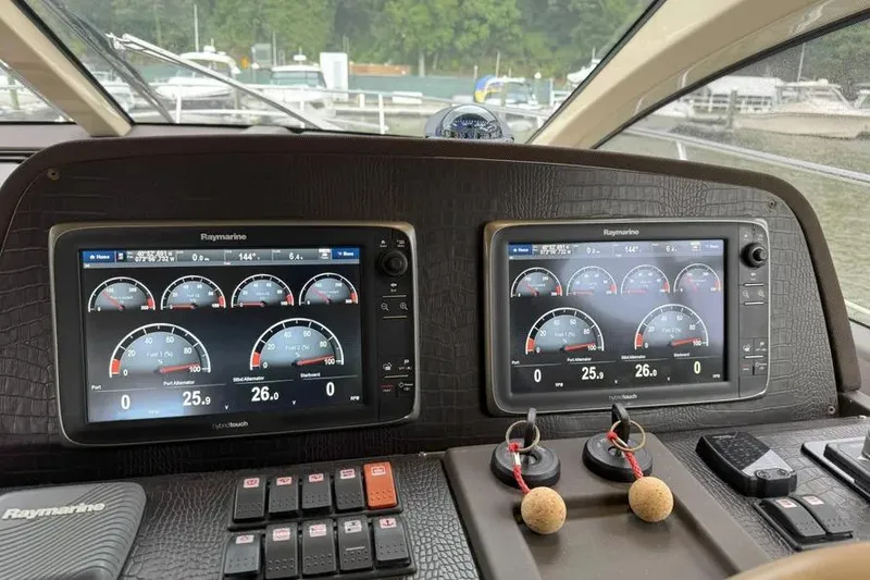 Slide: The Image of Control panel of a 2014 Azimut 45 yacht with Raymarine displays. - 63