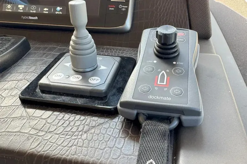 Slide: The Image of Control panel of a 2014 Azimut 45 yacht with joystick and dockmate system. - 65