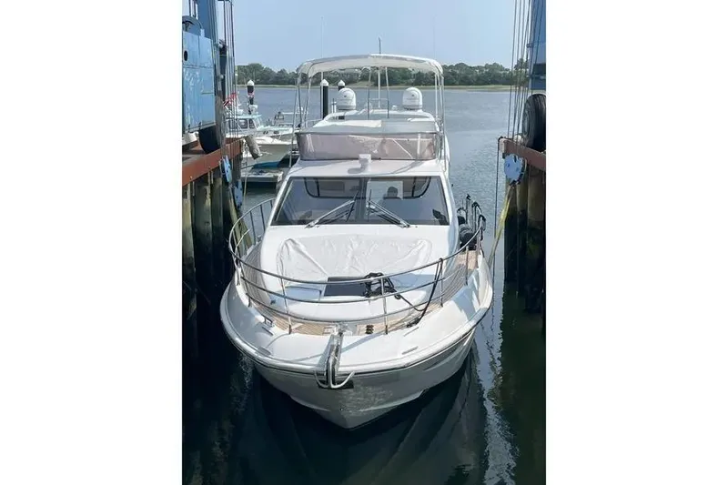 Slide: The Image of 2014 Azimut 45 yacht docked in a marina, front view. - 68