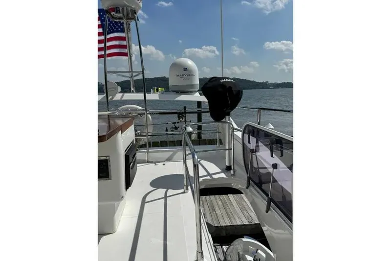 Slide: The Image of 2014 Azimut 45 yacht deck with American flag and navigational equipment. - 73