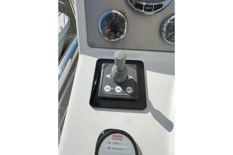 Slide: The Image of Control panel of a 2014 Azimut 45 yacht with joystick and gauges. - 74