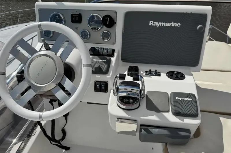 Slide: The Image of Control panel of a 2014 Azimut 45 yacht with Raymarine navigation system. - 76