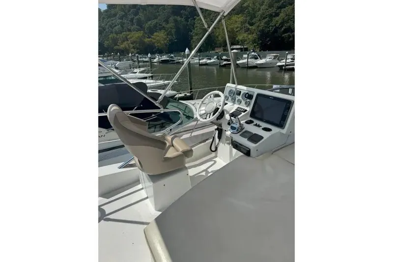 Slide: The Image of Cockpit of 2014 Azimut 45 yacht with steering wheel and navigation controls. - 77