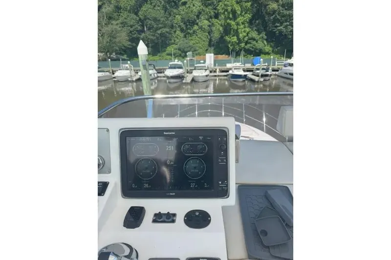 Slide: The Image of Cockpit view of 2014 Azimut 45 yacht with navigation display at marina. - 81