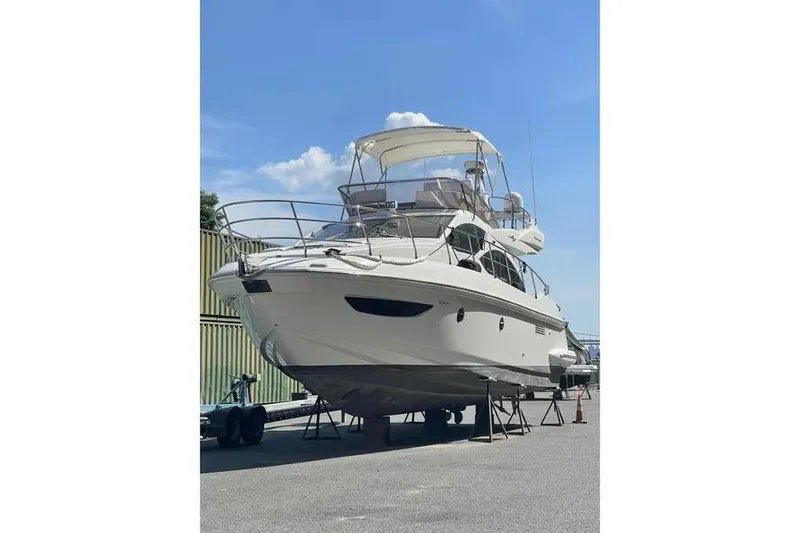 Slide: The Image of 2014 Azimut 45 yacht on dry dock under clear blue sky. - 82