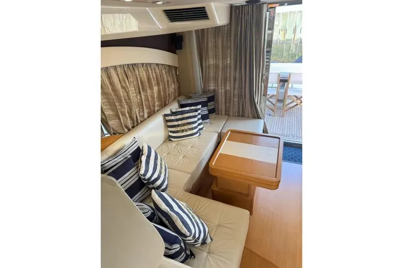 Slide: The Image of Luxurious interior of 2014 Azimut 45 yacht with striped cushions and wooden table. - 85