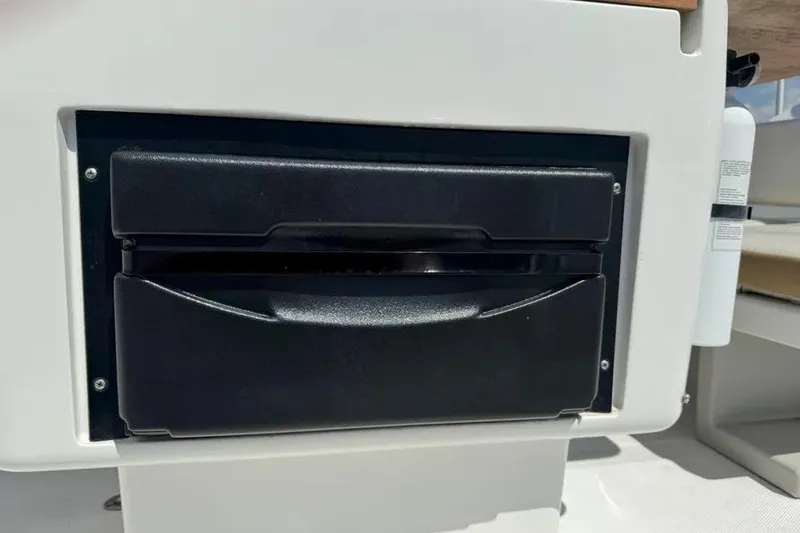 Slide: The Image of Built-in storage compartment on a 2014 Azimut 45 yacht, featuring a sleek black handle. - 87