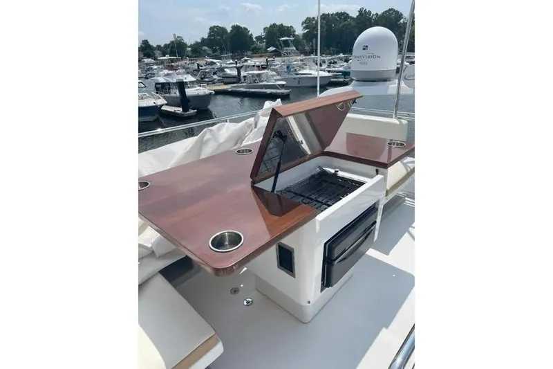 Slide: The Image of Outdoor grill on 2014 Azimut 45 yacht, docked at marina with other boats. - 90