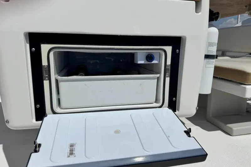 Slide: The Image of Open storage compartment on 2014 Azimut 45 yacht, featuring a built-in cooler. - 91