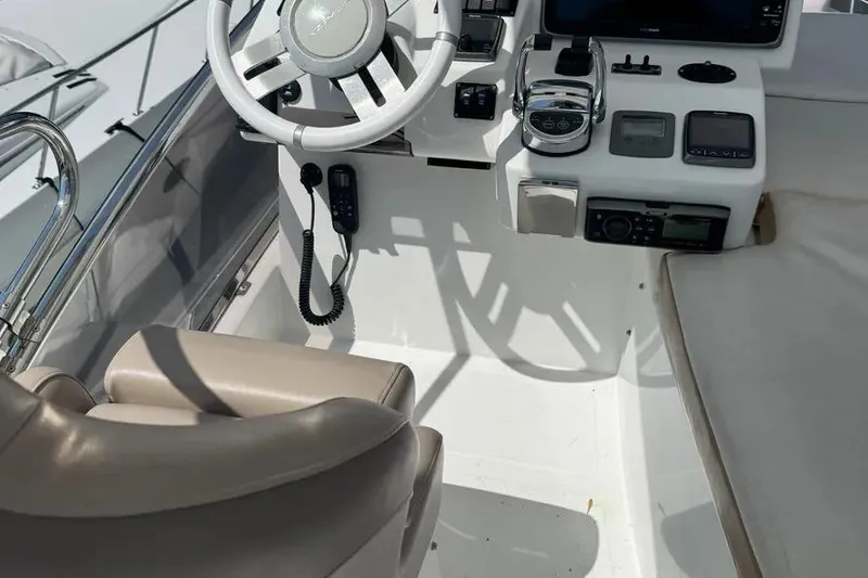 Slide: The Image of Cockpit of 2014 Azimut 45 yacht with steering wheel and control panel. - 92