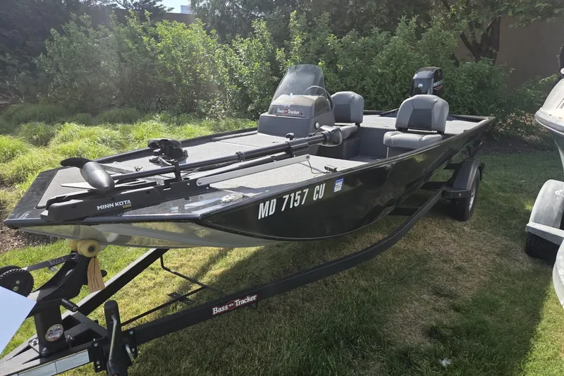 The Image of 2024 TRACKER MARINE CLASSIC XL boat on trailer, parked on grass. - 1