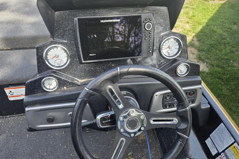 Slide: The Image of Dashboard of a 2021 Nitro Z19 Pro boat with steering wheel and Humminbird Helix 8 display. - 5