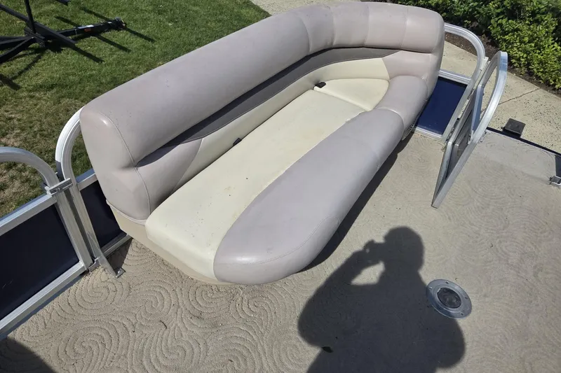 Slide: The Image of 2014 Sun Tracker Party Barge 24 with beige seating and open gate. - 5