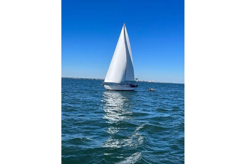 Slide: The Image of 2011 Reliance 44 sailboat on open sea. - 1