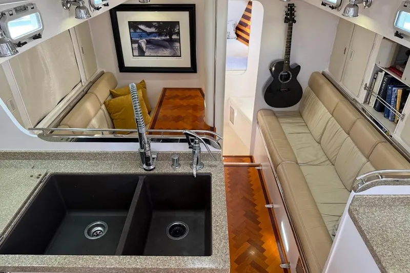 Slide: The Image of Luxurious interior of a 2011 Reliance 44 yacht with kitchen and seating area. - 12