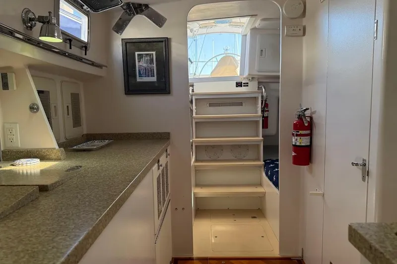 Slide: The Image of Interior of 2011 Reliance 44 yacht with stairs, countertop, and fire extinguisher. - 17