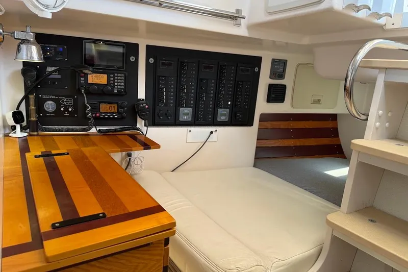 Slide: The Image of Interior of 2011 Reliance 44 yacht with navigation equipment and wooden desk. - 18