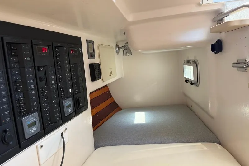 Slide: The Image of Interior cabin of 2011 Reliance 44 yacht with control panels and sleeping area. - 22