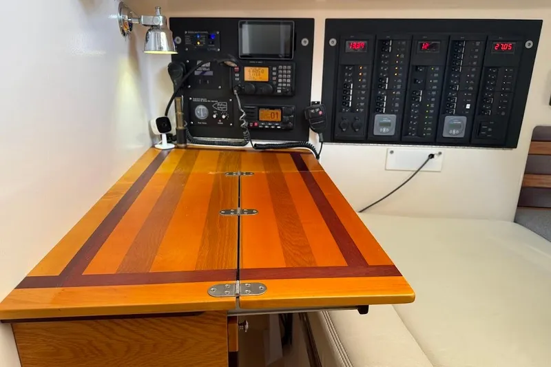 Slide: The Image of Navigation station with control panels in a 2011 Reliance 44 yacht. - 24