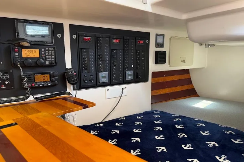 Slide: The Image of Interior of 2011 Reliance 44 yacht with navigation equipment and cozy sleeping area. - 26