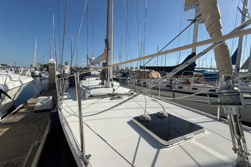 Slide: The Image of Sailboat docked at marina, Reliance 44 model, 2011, with clear blue sky. - 27