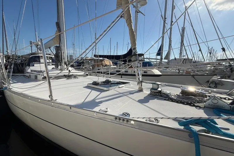 Slide: The Image of Sailboat Reliance 44, 2011 model, docked in a marina with clear skies. - 37