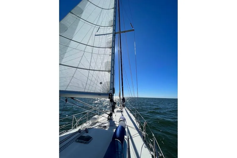 Slide: The Image of Sailing on a 2011 Reliance 44 yacht under clear blue skies. - 39