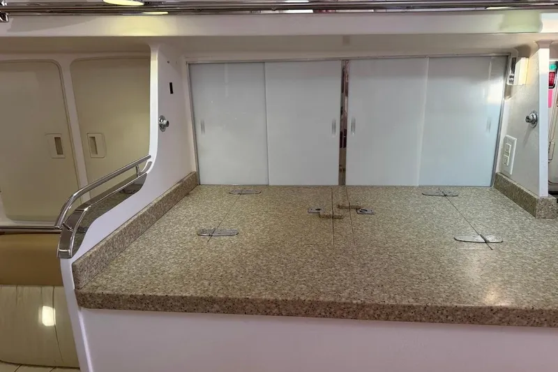 Slide: The Image of Interior of 2011 Reliance 44 yacht with granite countertop and sliding doors. - 5