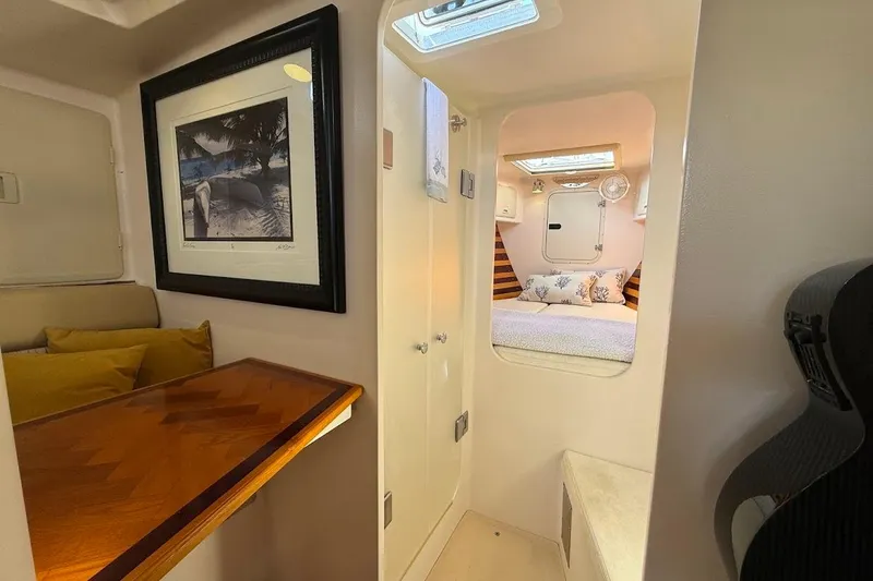 Slide: The Image of Interior of 2011 Reliance 44 yacht with cozy cabin and elegant wood finishes. - 8