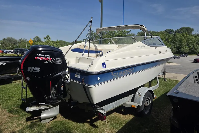 Slide: The Image of 1995 Sunbird Corsair boat with Mercury Pro XS 115 engine on a trailer. - 3