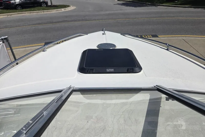 Slide: The Image of Bow view of a 1995 Sunbird Corsair boat with a closed hatch. - 7