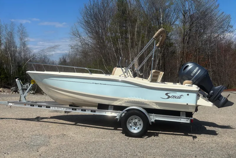 The Image of 2025 Scout 175 Sport Dorado boat on trailer outdoors. - 0