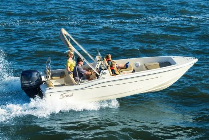 Slide: The Image of Manufacturer Provided Image: 2025 Scout 175 Sport Dorado boat cruising on open water with passengers. - 13