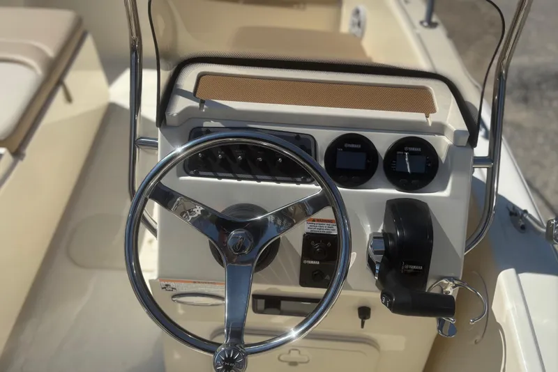 Slide: The Image of 2025 Scout 175 Sport Dorado helm with Yamaha instruments. - 8