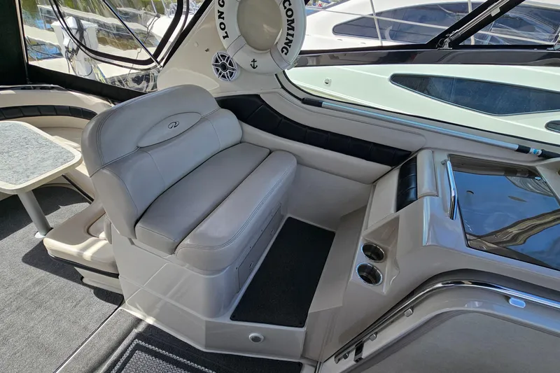 Slide: The Image of Interior of a 1997 Regal Commodore 402 yacht with plush seating and sleek design. - 12