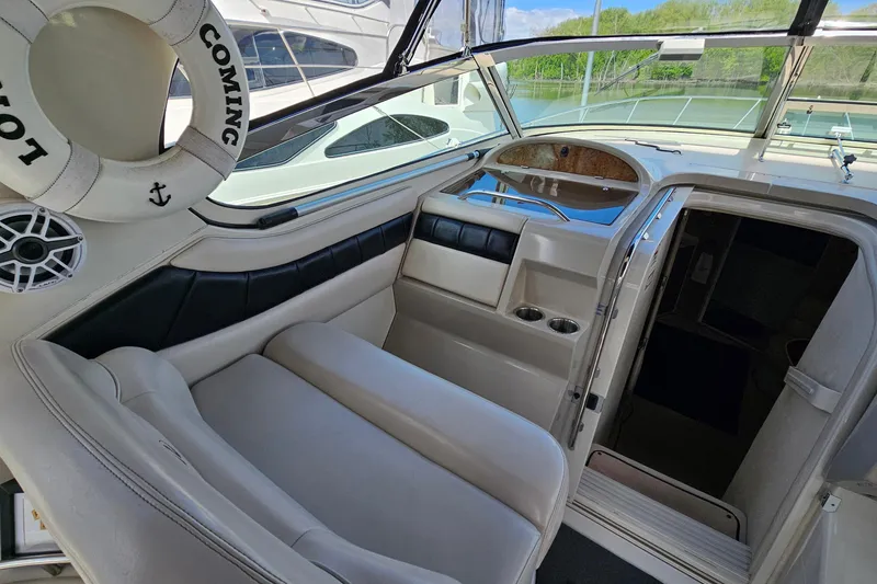 Slide: The Image of Interior of a 1997 Regal Commodore 402 boat with seating and life preserver. - 13