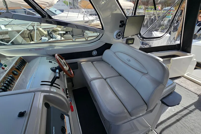 Slide: The Image of Interior of a 1997 Regal Commodore 402 yacht with leather seating and control panel. - 14