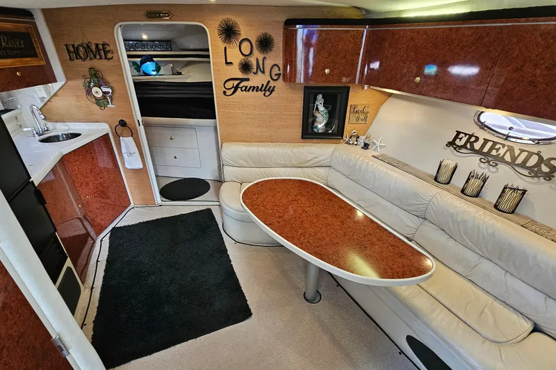 Slide: The Image of Interior of a 1997 Regal Commodore 402 yacht with cozy seating and elegant decor. - 17