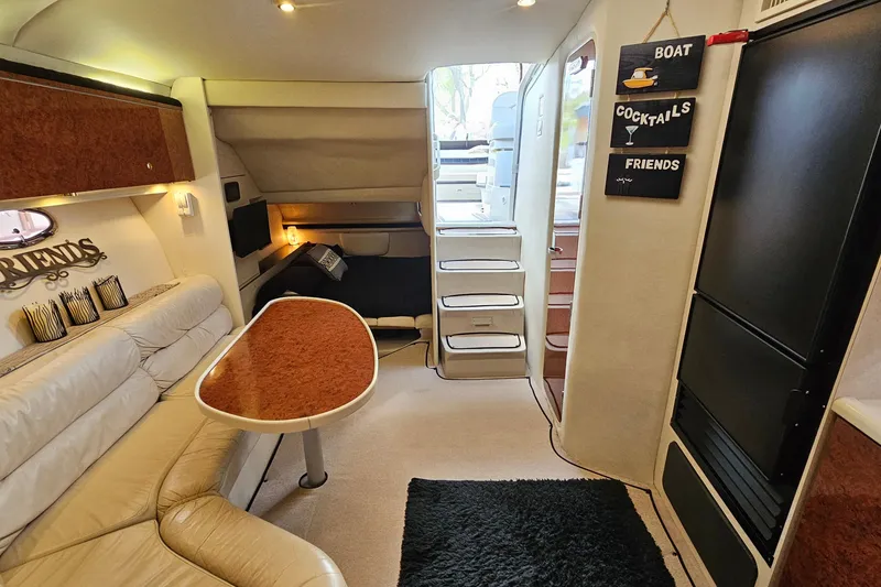 Slide: The Image of Interior of a 1997 Regal Commodore 402 yacht with cozy seating and decor. - 21