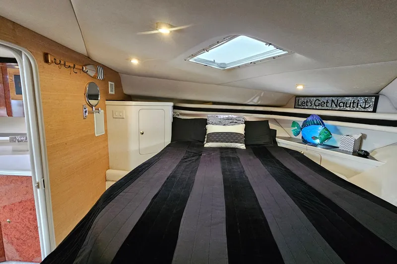 Slide: The Image of Cozy cabin interior of 1997 Regal Commodore 402 yacht with nautical decor. - 24