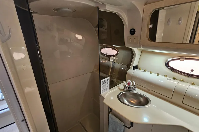 Slide: The Image of Bathroom interior of 1997 Regal Commodore 402 yacht with sink and shower. - 29