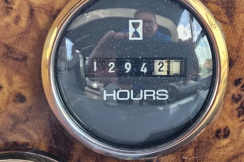 Slide: The Image of Hour meter showing 12,942 hours on a 1997 Regal Commodore 402. - 31