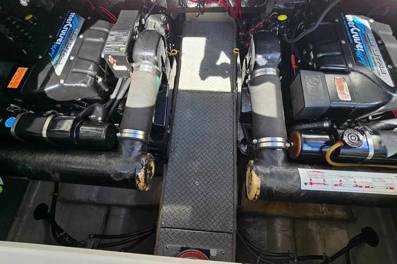 Slide: The Image of Engine compartment of a 1997 Regal Commodore 402 with dual MerCruiser engines. - 32
