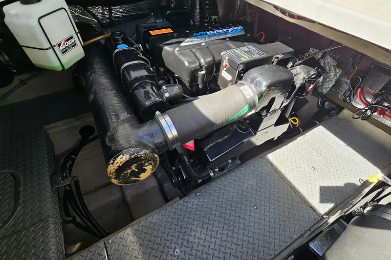 Slide: The Image of Engine compartment of a 1997 Regal Commodore 402 boat, showcasing mechanical components. - 33