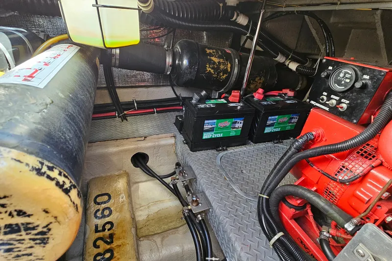 Slide: The Image of Engine room of a 1997 Regal Commodore 402 with batteries and control panel. - 38