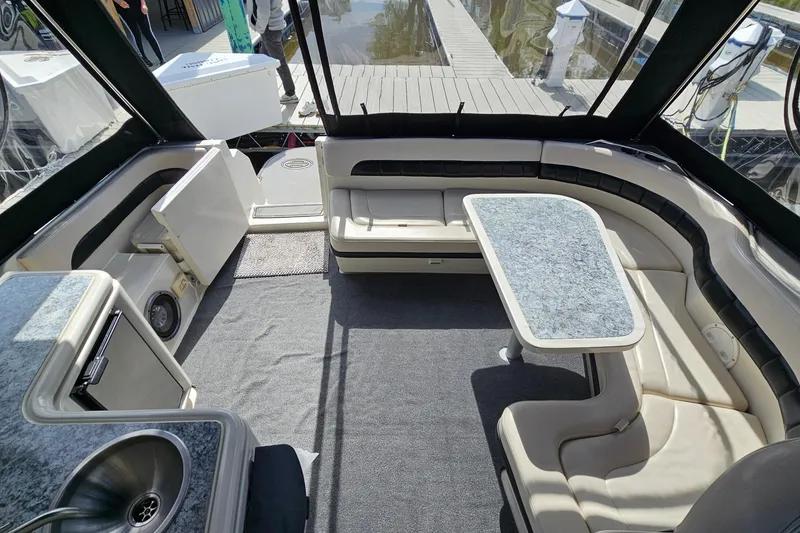 Slide: The Image of Luxurious interior of a 1997 Regal Commodore 402 yacht with seating and table. - 8