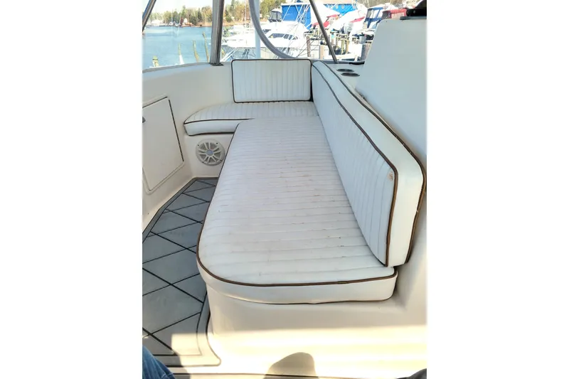 Slide: The Image of Interior of 1993 Ocean Yachts 38 Super Sport with white cushioned seating. - 10