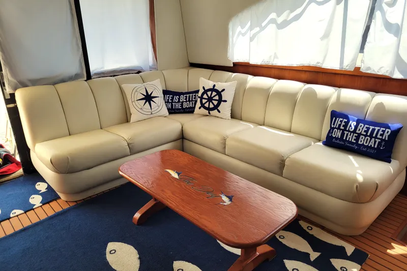 Slide: The Image of Luxurious interior of a 1993 Ocean Yachts 38 Super Sport with nautical decor. - 13