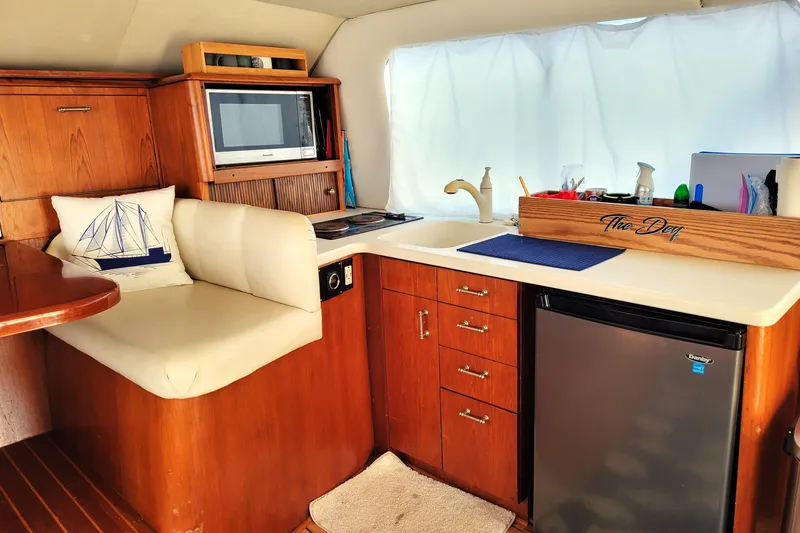 Slide: The Image of Luxurious interior of 1993 Ocean Yachts 38 Super Sport with plush seating and nautical decor. - 14