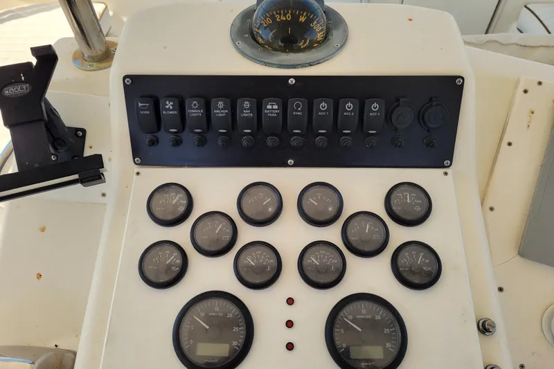 Slide: The Image of Cockpit of 1993 Ocean Yachts 38 Super Sport with Garmin navigation, marina view. - 6